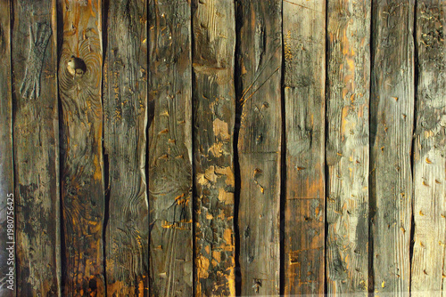 Wooden planks showing signs of wear and texture from age and use in a rustic setting, natural background