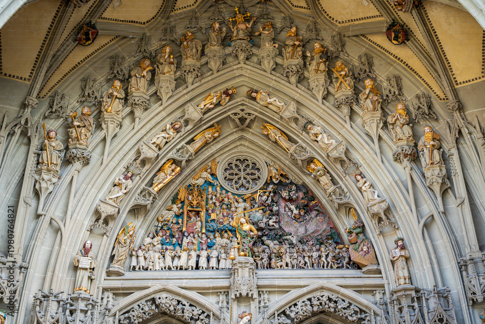 Obraz premium Bern, Switzerland - October 21, 2025 : Berner Muenster main portal intricate Last Judgment stone sculpture detail.