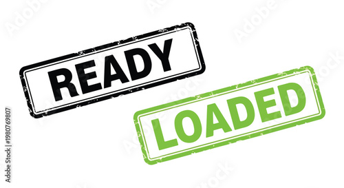 Close-up of two rubber stamps with the words ready and loaded in black and green ink on white background