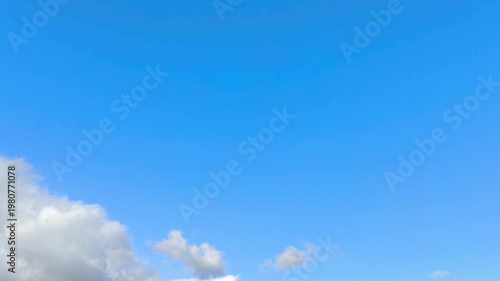 Light blue sky with amazing clouds at noon