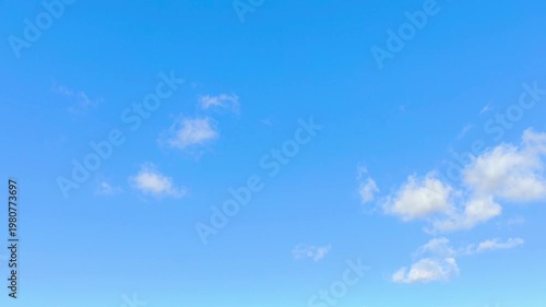 Midday clouds in the blue sky