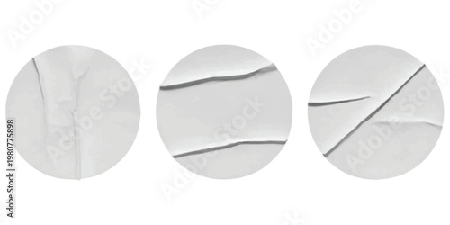 Three circular white paper stickers with realistic folds and creases on a clean isolated background