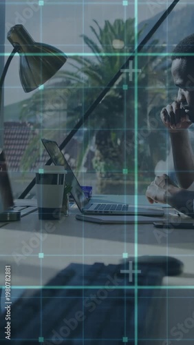 Vertical video: Manager moving from thinking to typing on data prompt, teal HUD tracking laptop