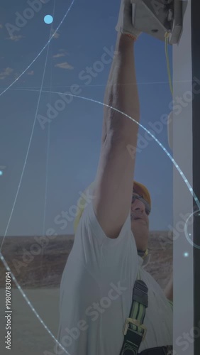 Vertical video: Field tech starting telecom repair, reaching box, routing cable as HUDs pulsing