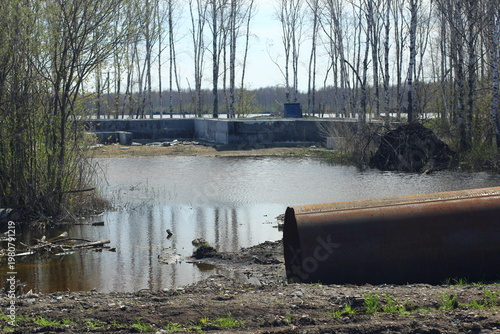 Careless attitude towards nature. Uprooted trees, flooded forests, pollution and industrial waste products of oil refining. Extraction of minerals by open method.