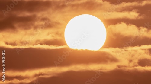 Big Sun Rising Above Morning Clouds Timelapse, Golden Sunrise with Glowing Solar Disk