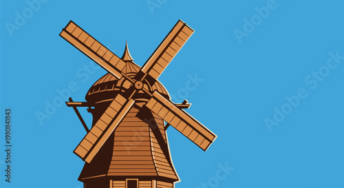 A stylized, rustic windmill with large blades stands against a clear blue sky