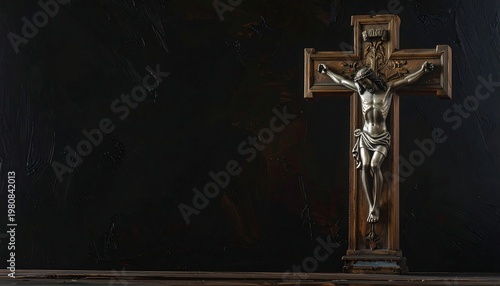 A silver crucifix on a dark background