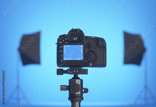 Blue photo studio. Camera and lights. 3D render.