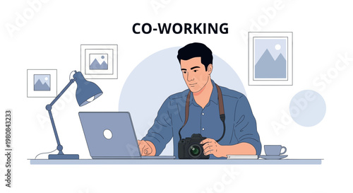 Freelancer photographer working on laptop in co-working space with camera and art