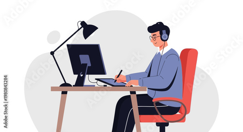 Graphic Designer Working on Computer with Tablet and Headphones