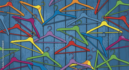 A vibrant assortment of colorful clothes hangers scattered on a textured blue wooden background