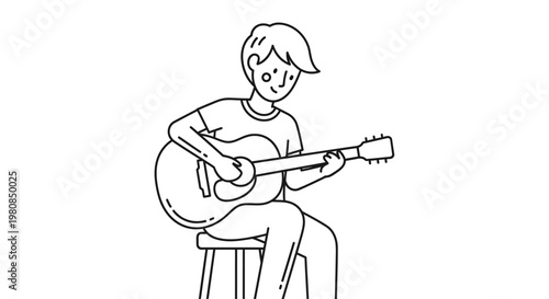 Young man playing acoustic guitar sitting.