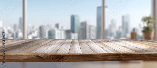Empty wooden table top, blurry city skyline through office window, bright day