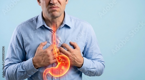 Stomach pain experienced by an adult man manifests as a glowing internal illustration highlighting the area of gastrointestinal discomfort and acid reflux symptoms for medical health communication.