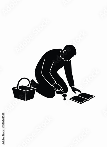 Man crouching examining mushroom with book and basket for foraging identifying edible wild plants.