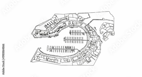 Aerial view of a marina with boats docked and buildings lining the harbor