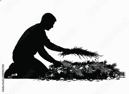 Man kneeling gathering leaves and pine needles for compost.