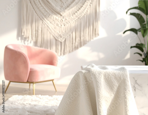 Cozy living room corner with pink armchair and macrame wall hanging