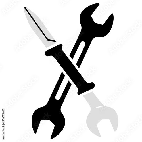 Tools crossed over each other on a plain surface including wrench and knife