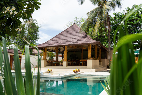 Resort restaurant gazebo next to a swimming pool, offering a relaxing escape