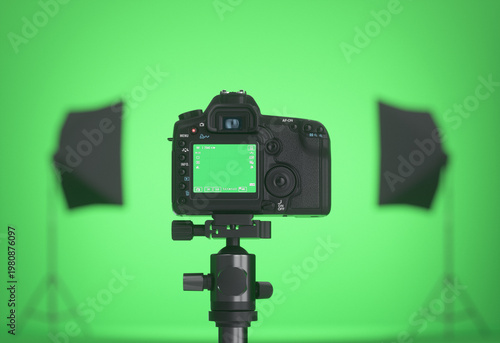 Empty green screen studio. View from the back of a professional camera. 3D render.