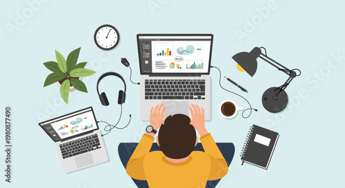 Man working on laptop computer at desk.