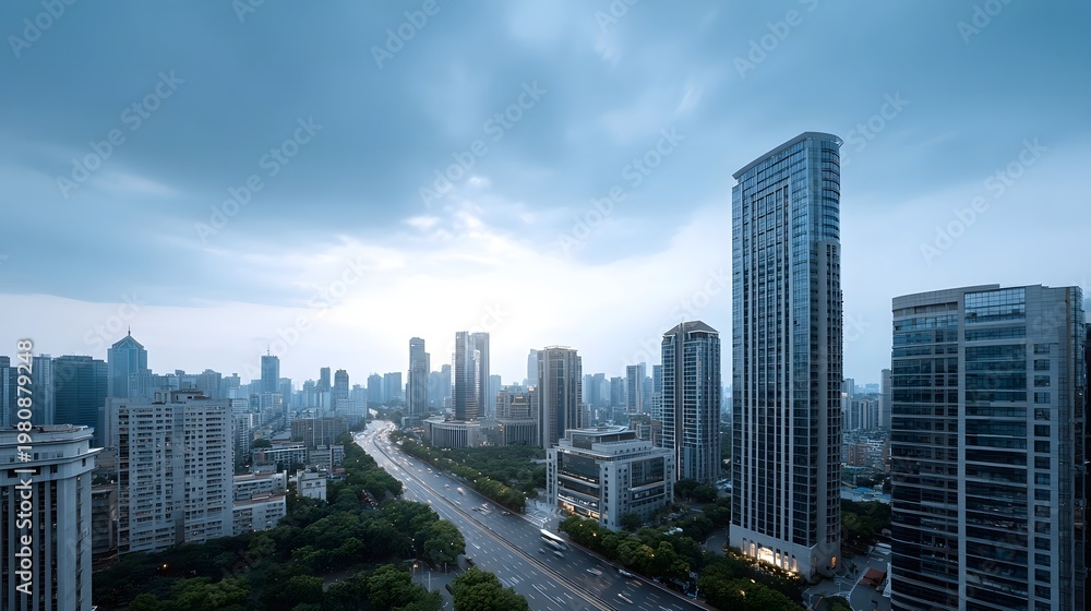 Obraz premium Panoramic view of a modern metropolis featuring towering skyscrapers and wide boulevards under a dramatic twilight sky
