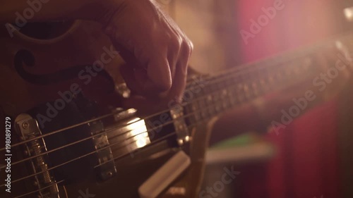 Music Studio Strumming Bassist Close Up Bass Guitar Playing Recording Session Professional Music Performance Rhythm Groove Sound Production Creative Studio Practice 4K Video