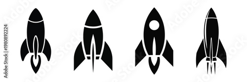 Collection of four black silhouette rocket ship icons