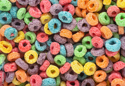 Photos Delicious and nutritious fruit cereal rings as background, top view