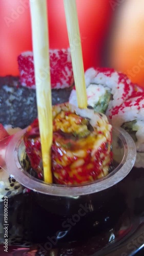 Philadelphia rolls, close-up sushi. Vertical video. Salmon sushi, assorted rice rolls. Ginger and chopsticks.