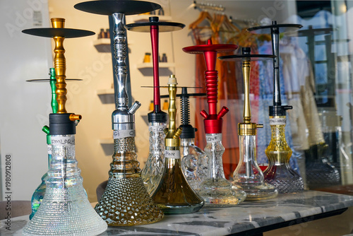 Bild auf Leinwand Diverse Collection of Traditional Shisha and Hookah Pipes in a Cafe Setting