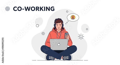 Young man with headphones working on laptop and phone in co-working space