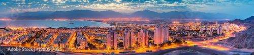 Aerial view with sunrise above Eilat and range of mountains