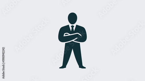 A confident businessman standing with his arms crossed in a suit and tie