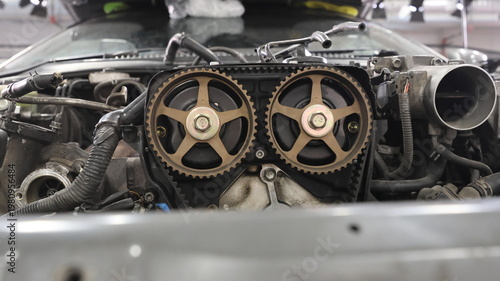 Konstfotografi Close-up of a car engine with exposed timing gears and dual overhead camshafts