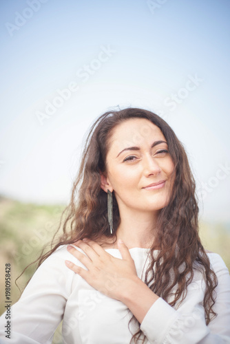 Portrait of a young beautiful brunette woman against the backdrop of the nature of northern Israel