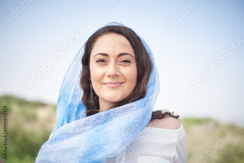 Portrait of a young beautiful brunette woman against the backdrop of the nature of northern Israel