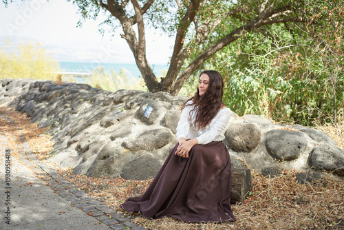Portrait of a young beautiful brunette woman against the backdrop of the nature of northern Israel