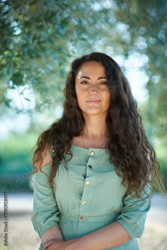 Portrait of a young beautiful brunette woman against the backdrop of the nature of northern Israel