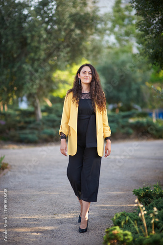 Portrait of a young beautiful brunette woman against the backdrop of the nature of northern Israel
