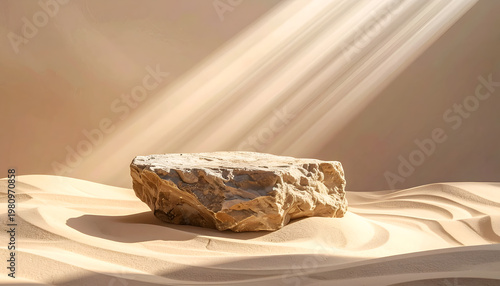A weathered stone pedestal rests amidst softly sculpted sand dunes, bathed in dramatic sunlight.