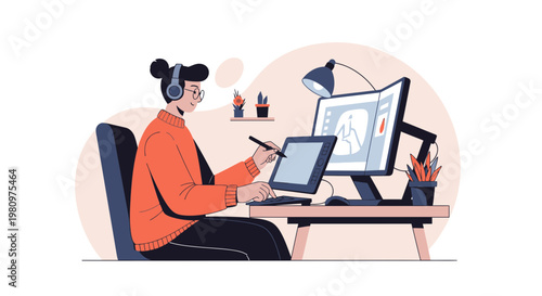 Graphic designer working on computer with tablet, headphones, creative workspace