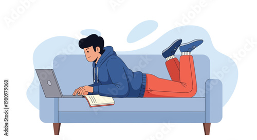 Young man lying on couch using laptop, studying or working remotely, comfortable home office