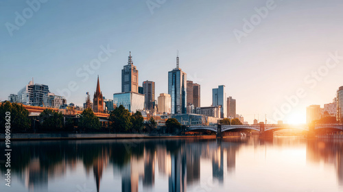 Melbourne city skyline at sunset reflecting on Yarra River, showing modern buildings and urban architecture