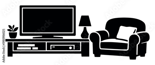 Living room setup showing a television on a media console with a lamp, decorative plant, and comfortable armchair nearby