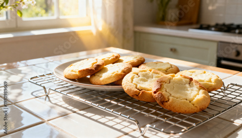 A plate of freshly baked cookies, still warm from the oven, on a cooling rack in a sunlit kitchen during a bright spring morning