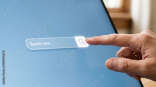 Finger Presses Search Button on a Digital Screen with Search Bar