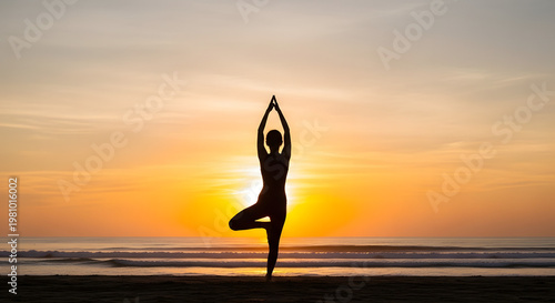 Silhouette of a person practicing yoga tree pose on a beach at sunset, with a beautiful orange sky and ocean waves.